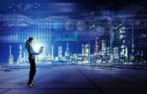 Woman standing in front of a city-scape holding a laptop with a background of various graphs